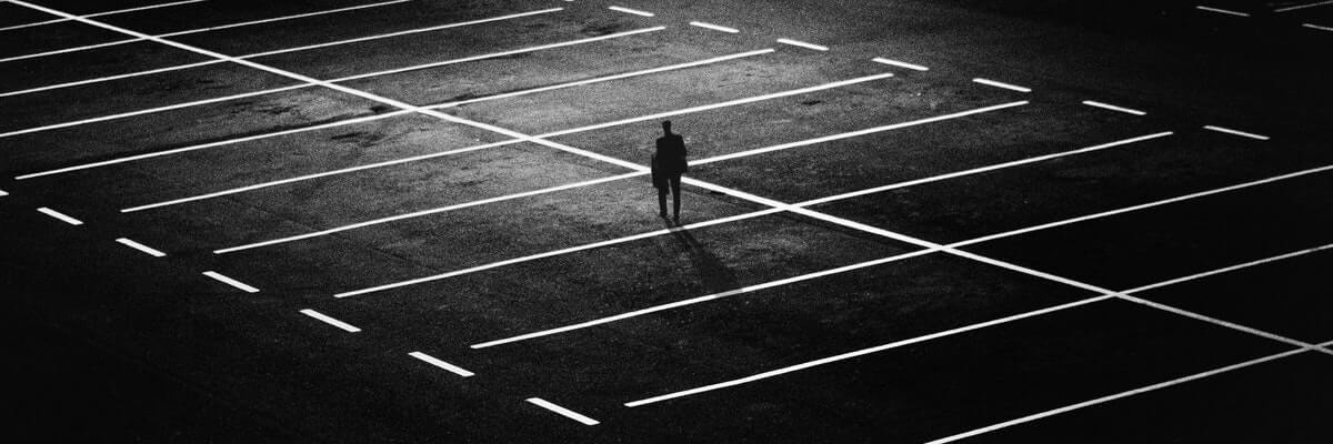 man in the middle of a parking lot